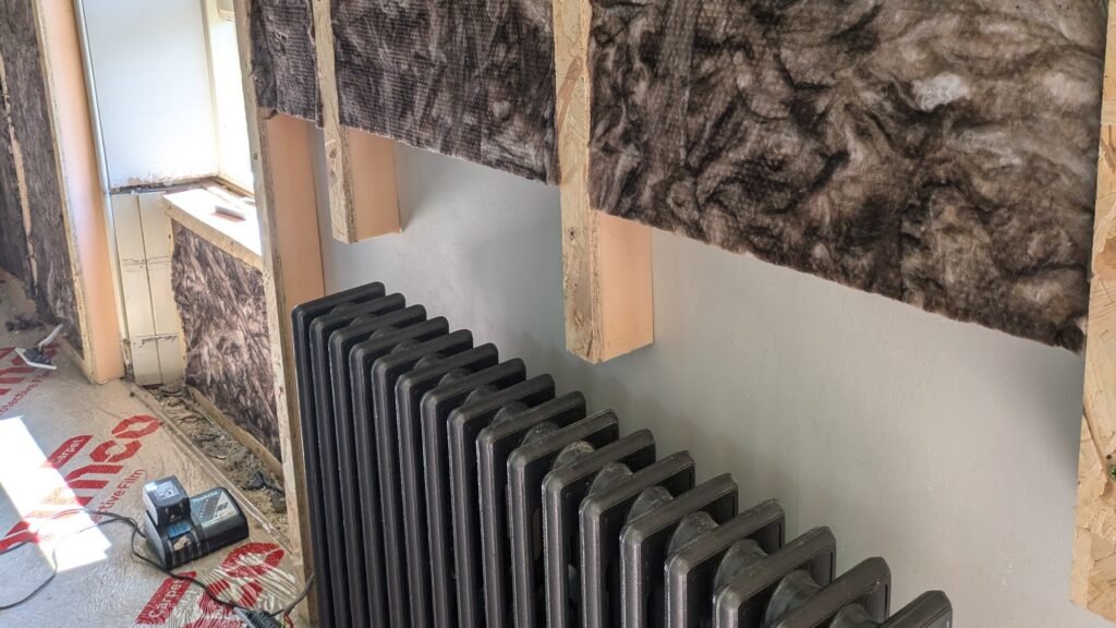 wall being built around oroginal radiator july 24